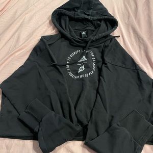Medium cropped Peloton “Together We Go Far” pullover black Adidas sweatshirt